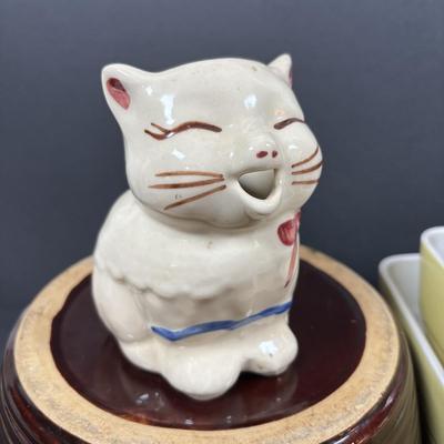 LOT 261: Hall for Westing House Refrigerator Dishes (no lids), Brown Glaze Bowl USA, Shawnee Cat Creamer, National Dairy Orange Juice...