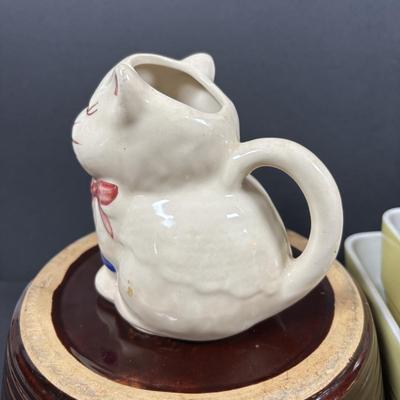 LOT 261: Hall for Westing House Refrigerator Dishes (no lids), Brown Glaze Bowl USA, Shawnee Cat Creamer, National Dairy Orange Juice...