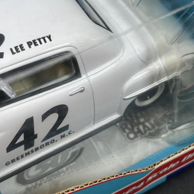 LOT 262: NASCAR Collectibles: Signed Ken Schrader & Buckshot Jones Die Cast Cars NIP, Lee Petty NIP 1949 Plymouth Die Cast