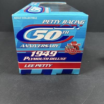 LOT 262: NASCAR Collectibles: Signed Ken Schrader & Buckshot Jones Die Cast Cars NIP, Lee Petty NIP 1949 Plymouth Die Cast