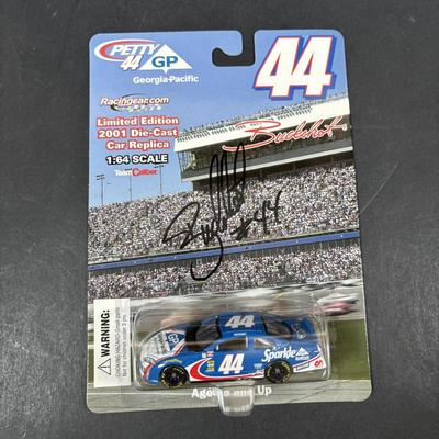 LOT 262: NASCAR Collectibles: Signed Ken Schrader & Buckshot Jones Die Cast Cars NIP, Lee Petty NIP 1949 Plymouth Die Cast