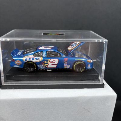 LOT 262: NASCAR Collectibles: Signed Ken Schrader & Buckshot Jones Die Cast Cars NIP, Lee Petty NIP 1949 Plymouth Die Cast