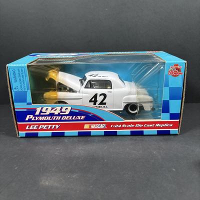 LOT 262: NASCAR Collectibles: Signed Ken Schrader & Buckshot Jones Die Cast Cars NIP, Lee Petty NIP 1949 Plymouth Die Cast