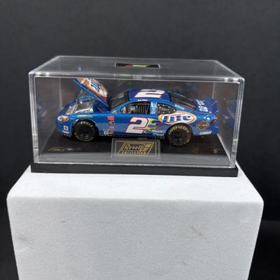 LOT 262: NASCAR Collectibles: Signed Ken Schrader & Buckshot Jones Die Cast Cars NIP, Lee Petty NIP 1949 Plymouth Die Cast