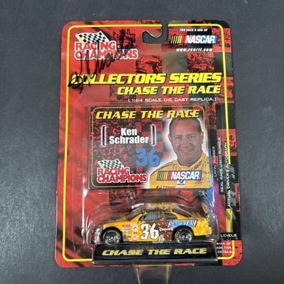 LOT 262: NASCAR Collectibles: Signed Ken Schrader & Buckshot Jones Die Cast Cars NIP, Lee Petty NIP 1949 Plymouth Die Cast