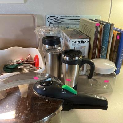 Sale Photo Thumbnail #230: Cookbooks, Pan, utensils, And more.