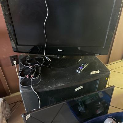 Sale Photo Thumbnail #257: Two TVs and Stand.
