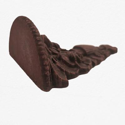 Carved wall shelf
