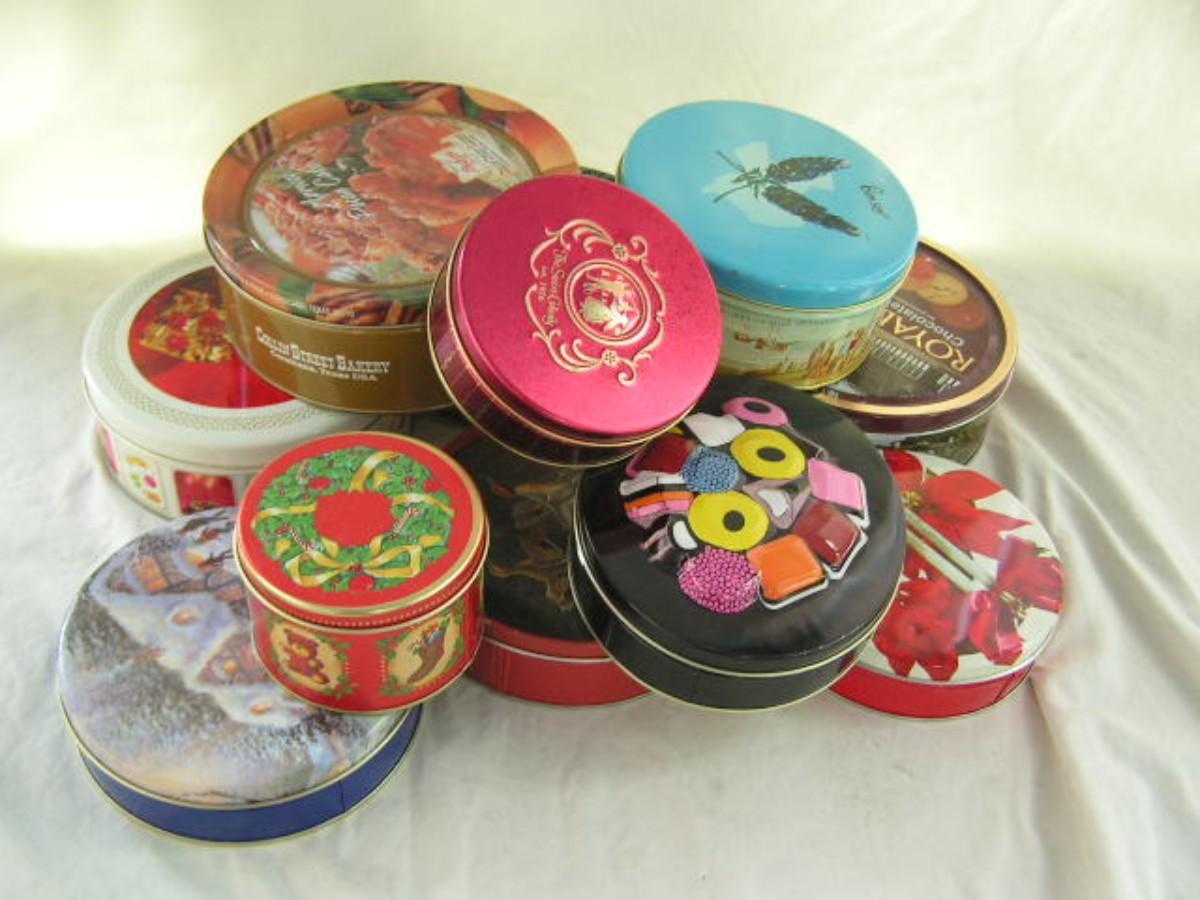 11 assorted tins, various sizes in a box | EstateSales.org