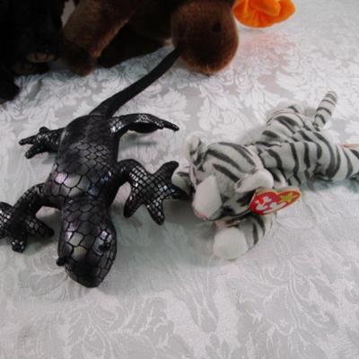 3 Ty stuffed animals, 1 stuffed lizard, 1 raccoon hat with gloved ends