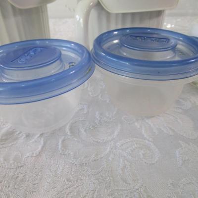 6 containers, various sizes, most with lids