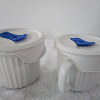 6 containers, various sizes, most with lids