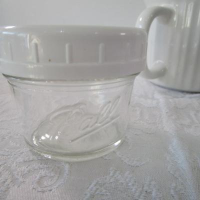 6 containers, various sizes, most with lids