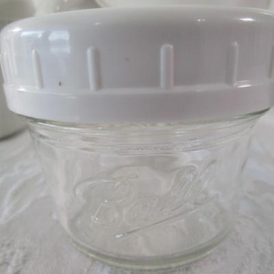 6 containers, various sizes, most with lids