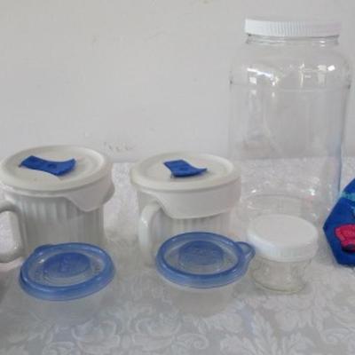 6 containers, various sizes, most with lids