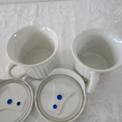 6 containers, various sizes, most with lids