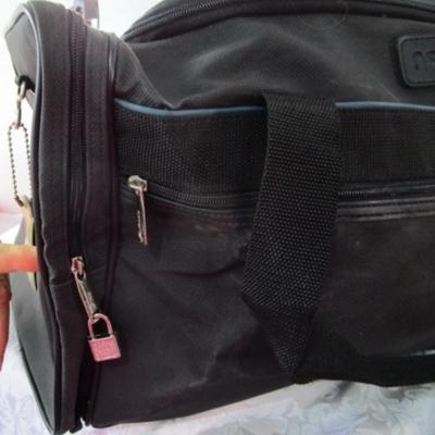 2 Ascot bags with luggage tags, feet, and shoulder straps