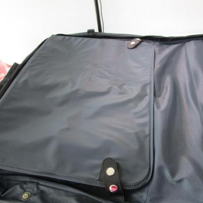 American Tourister garment bag with luggage tag