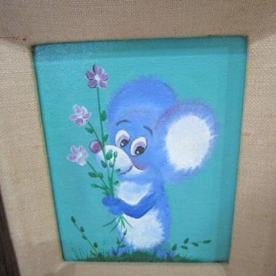 Framed painting of a mouse