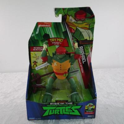 New in pkg, Teenage Mutant Ninja Turtles Raphael, flips & yells