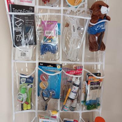 HANGING ORGANIZER FULL OF CRAFT AND SEWING SUPPLIES