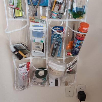 HANGING ORGANIZER FULL OF CRAFT AND SEWING SUPPLIES