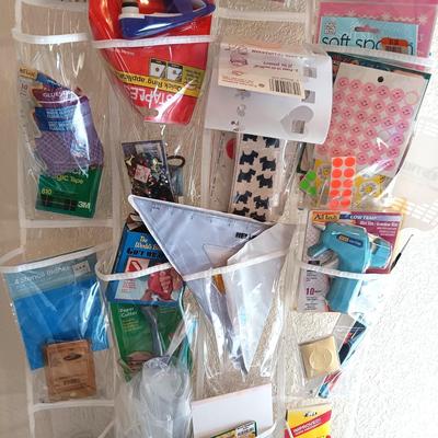 HANGING ORGANIZER FULL OF CRAFT AND SEWING SUPPLIES
