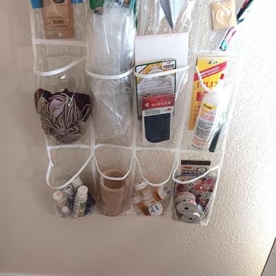 HANGING ORGANIZER FULL OF CRAFT AND SEWING SUPPLIES