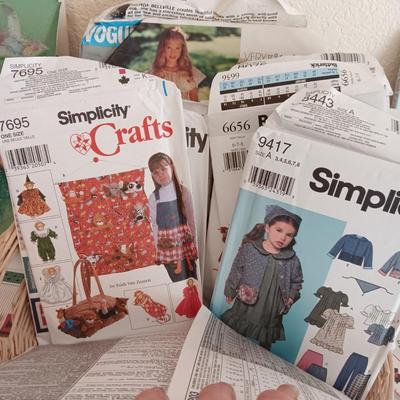 AN ASSORTMENT OF SEWING PATTERNS AND INSTRUCTION BOOKS