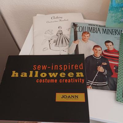 AN ASSORTMENT OF SEWING PATTERNS AND INSTRUCTION BOOKS