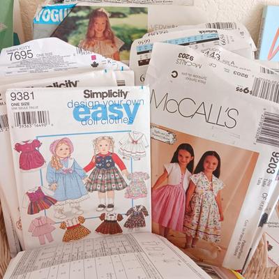 AN ASSORTMENT OF SEWING PATTERNS AND INSTRUCTION BOOKS