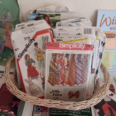 AN ASSORTMENT OF SEWING PATTERNS AND INSTRUCTION BOOKS