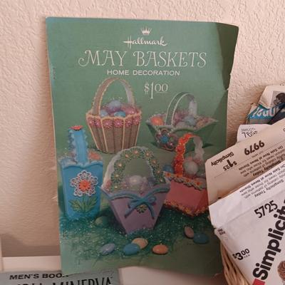 AN ASSORTMENT OF SEWING PATTERNS AND INSTRUCTION BOOKS