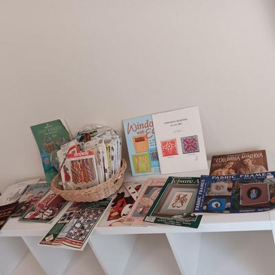 AN ASSORTMENT OF SEWING PATTERNS AND INSTRUCTION BOOKS