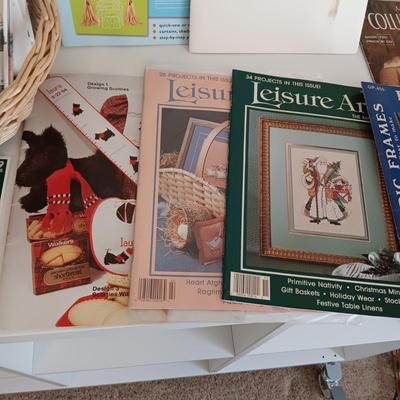AN ASSORTMENT OF SEWING PATTERNS AND INSTRUCTION BOOKS