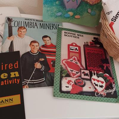 AN ASSORTMENT OF SEWING PATTERNS AND INSTRUCTION BOOKS