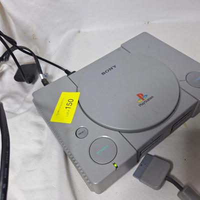 Sale Photo Thumbnail #420: this is an original play station but we can't get it to do anything other than turn on.