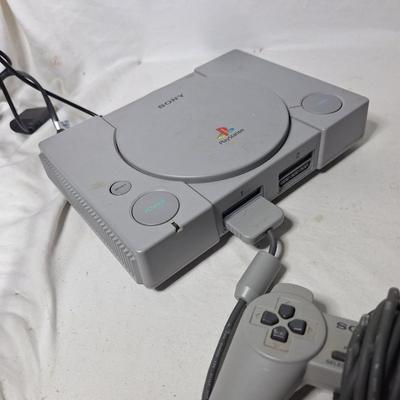Sale Photo Thumbnail #421: this is an original play station but we can't get it to do anything other than turn on.