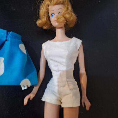 Sale Photo Thumbnail #461: we think this was the first Midge released.  Notice the stamp on her rear, painted fingernails, blue eyes, curved eyebrows.  We are not barbie experts.  Please see photos.