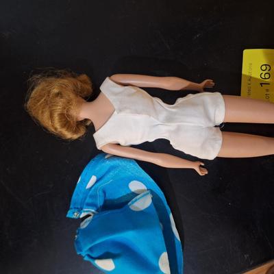 Sale Photo Thumbnail #458: we think this was the first Midge released.  Notice the stamp on her rear, painted fingernails, blue eyes, curved eyebrows.  We are not barbie experts.  Please see photos.