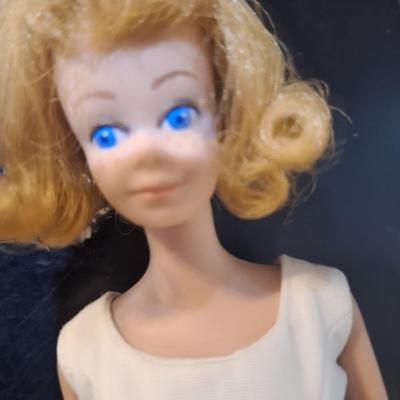 Sale Photo Thumbnail #451: we think this was the first Midge released.  Notice the stamp on her rear, painted fingernails, blue eyes, curved eyebrows.  We are not barbie experts.  Please see photos.