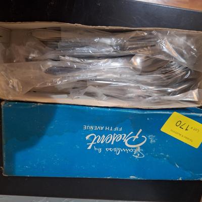 Sale Photo Thumbnail #462: looks to be an entire set but we did not confirm it.  There is something on some of the plastic protective sleeves like something was spilled but has dried up, the flatware inside are all clean.