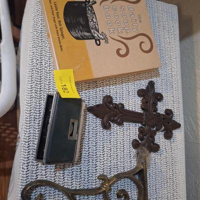 Sale Photo Thumbnail #491: cookbook, metal wall cross, a wall hook to hang a plant and vintage pocket binoculars
