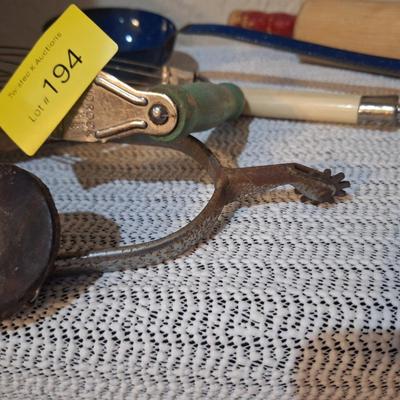 Sale Photo Thumbnail #534: a single spur, the center of a hub cap and a few random kitchen items.