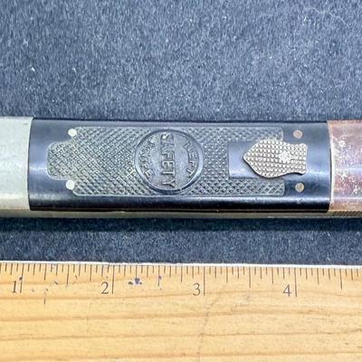 Sale Photo Thumbnail #727: Folding Safety Knife, Style No. 1. Some wear and surface tarnish from handling. Good working condition. Folded length is approx. 5.5" and unfolded length is approx. 9.5".