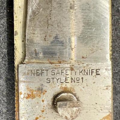 Sale Photo Thumbnail #725: Folding Safety Knife, Style No. 1. Some wear and surface tarnish from handling. Good working condition. Folded length is approx. 5.5" and unfolded length is approx. 9.5".