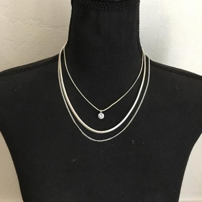 Very nice silver toned, layered chain crystal charm necklace