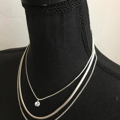 Very nice silver toned, layered chain crystal charm necklace