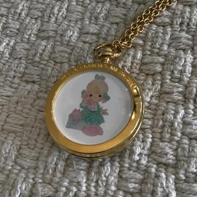 Gold tone precious moments pocket watch