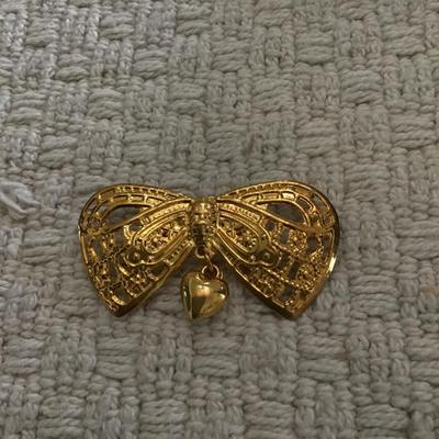 Gold tone bow brooch